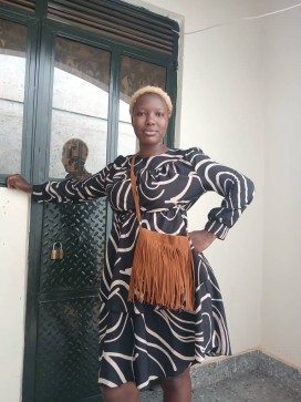Chomi, 27, Uganda